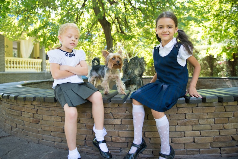 school girls on wall